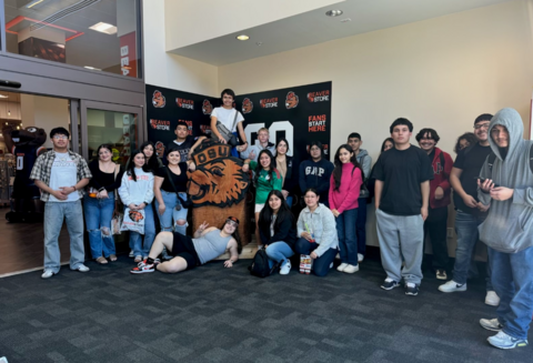 A large group of students standing in front of an Oregon State University banner